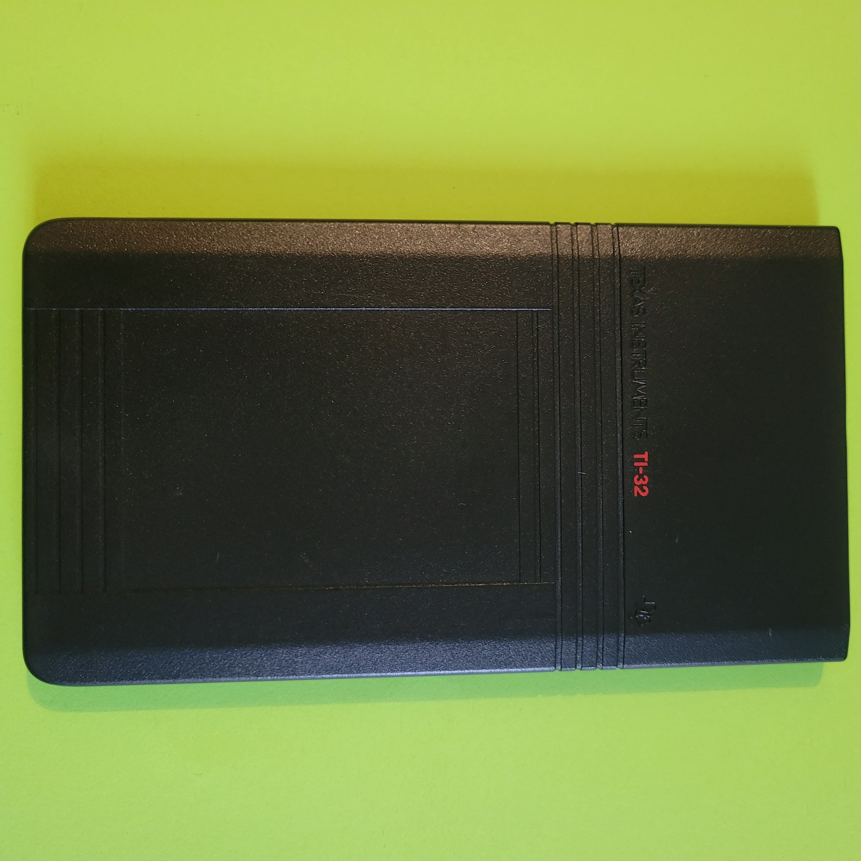 An image of the case of a texas instruments ti-32 scientific/engineering calculator